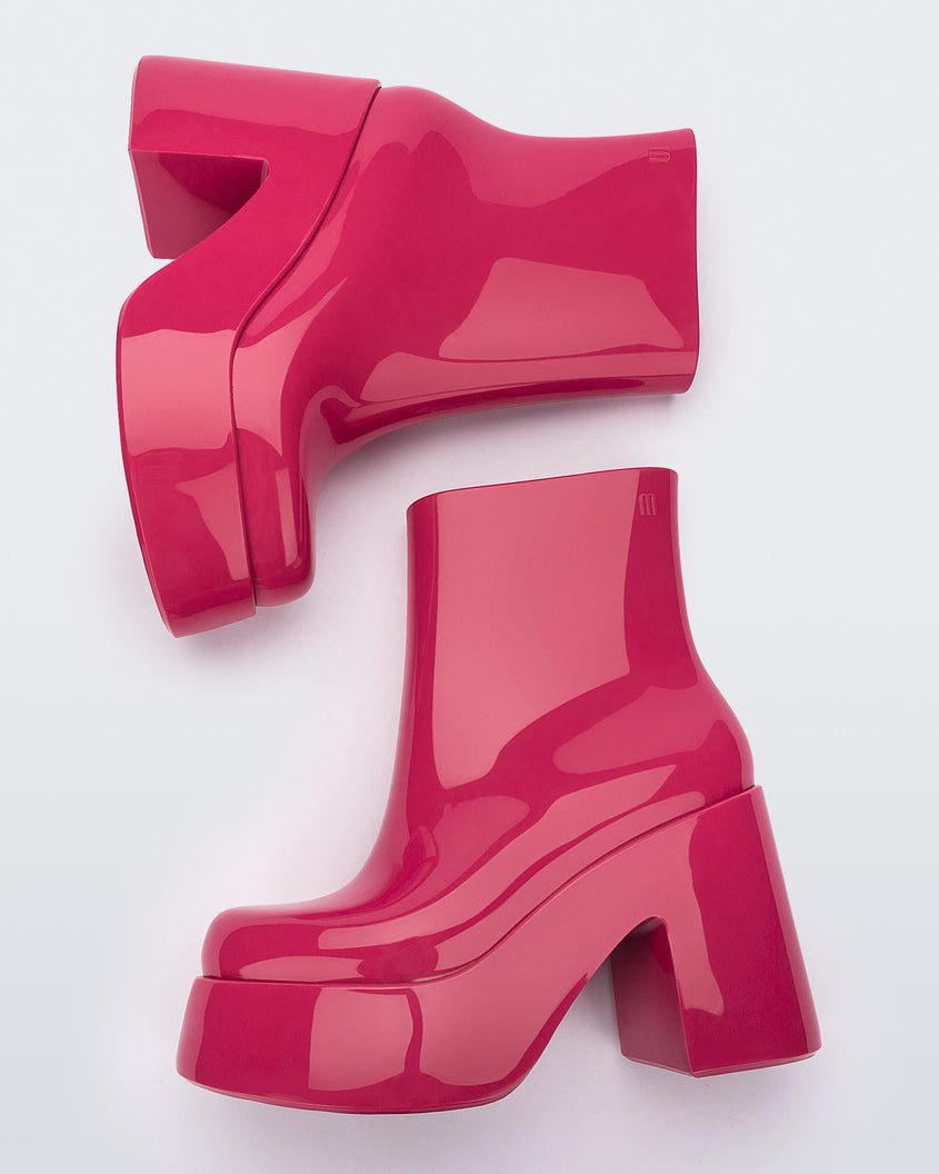 Top view of a pair of pink Melissa Nubia  platform heel boots.
