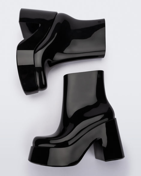 Top view of a pair of black Melissa Nubia  platform heel boots.