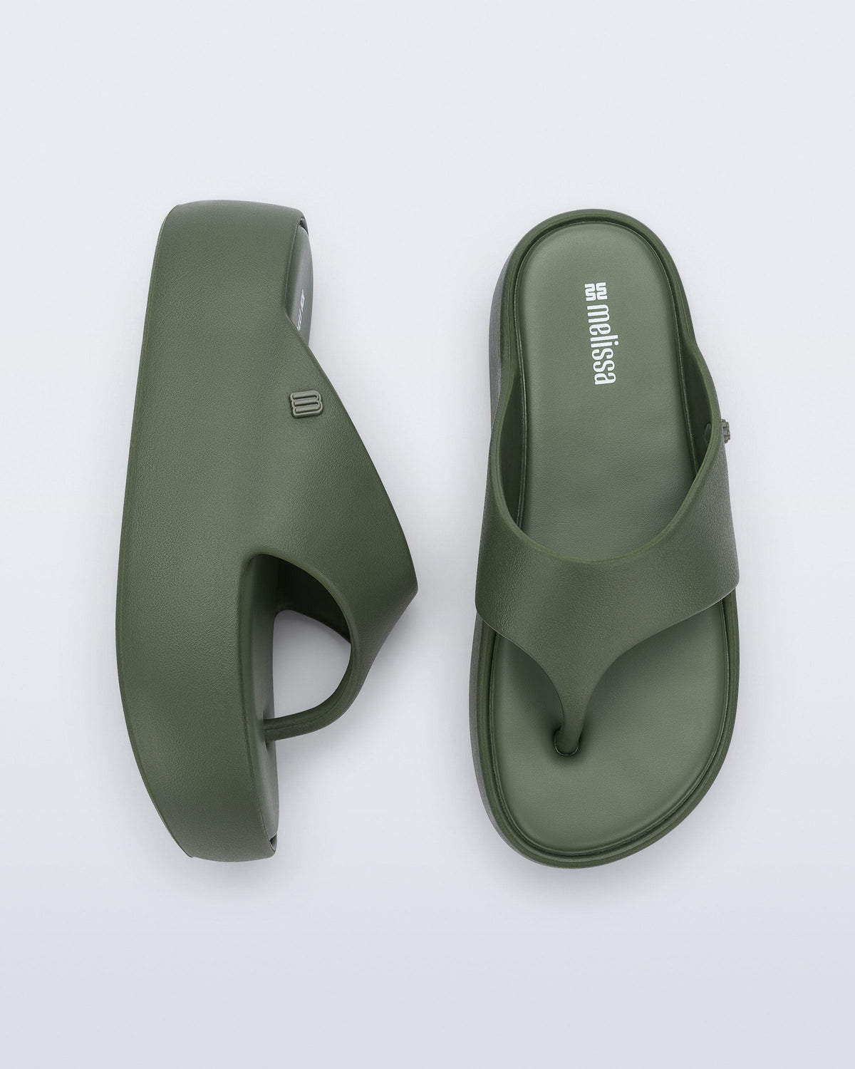 Side and top view of a pair of green Free Platform Thong flip flops