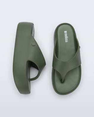 Side and top view of a pair of green Free Platform Thong flip flops