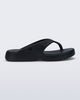 Side view of a black Free Thong Low flip flop