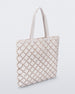 Angled view of a white Melissa Mogu  + Hikaru Matsumura bag