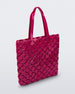 Angled view of a pink Melissa Mogu  + Hikaru Matsumura bag
