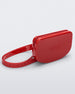 Angled view of the red Melissa Go Easy Bag with strap