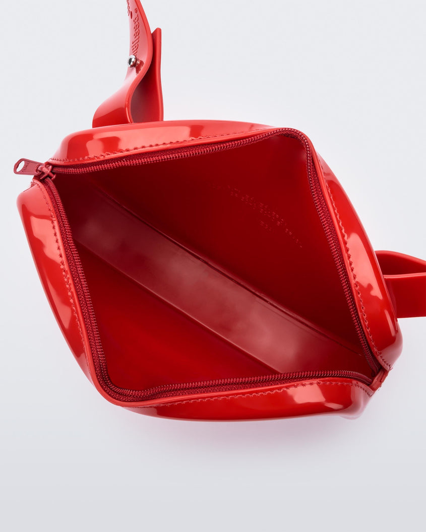Top view of the red Melissa Go Easy Bag with strap