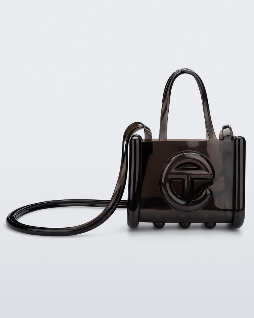 Front view of a black small Melissa Jelly Shopper bag + Telfar bag with a handle and straps.