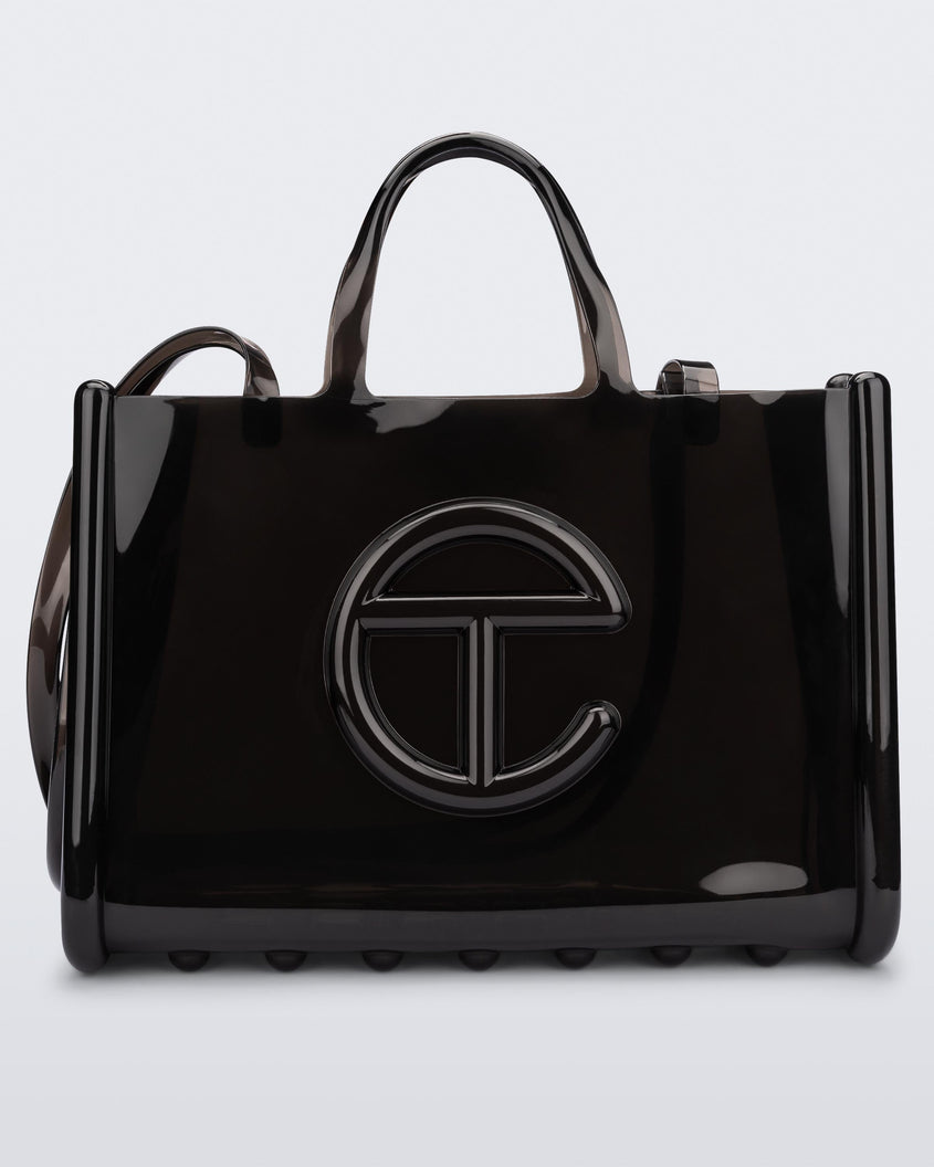 Front view of a black large Melissa Jelly Shopper bag + Telfar bag with a handle and straps.