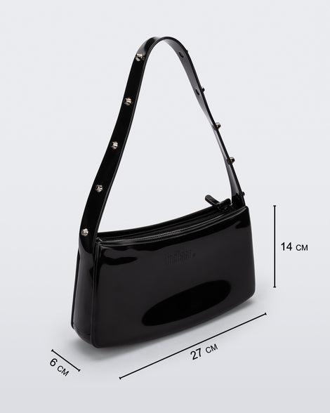 Angled view of the black Melissa Baguete Studs bag with a short studded strap, showing dimensions, 27 cm length, 6 cm width, and 14 cm height.