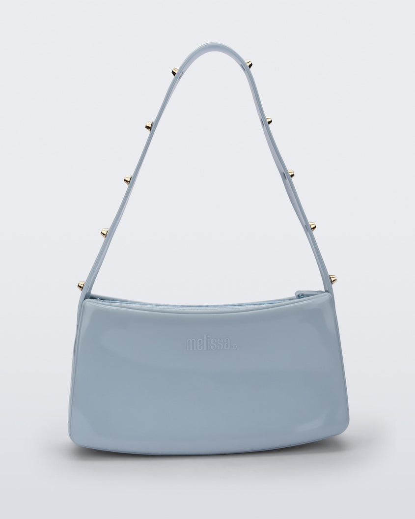 Front view of the blue Melissa Baguete Studs bag with a short studded strap.