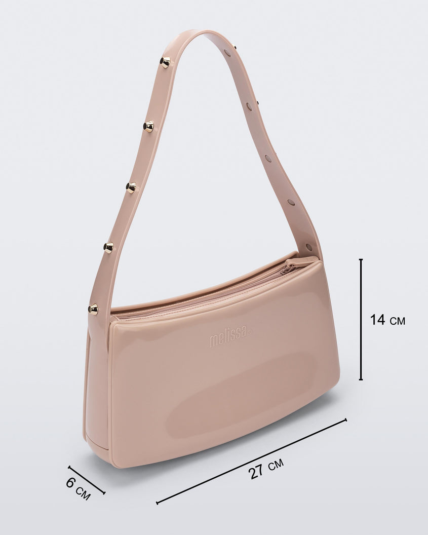 Angled view of the pink Melissa Baguete Studs bag with a short studded strap, showing dimensions, 27 cm length, 6 cm width, and 14 cm height.
