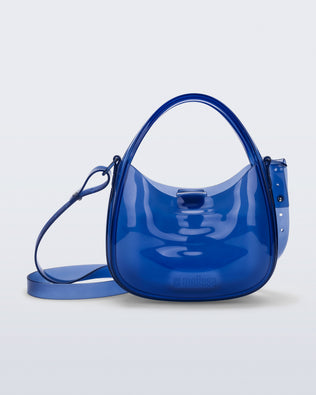 Front view of a clear blue Mirror bag with cross body straps two clear handles