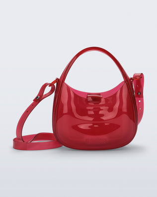 Front view of a clear red Mirror bag with cross body straps two clear handles.
