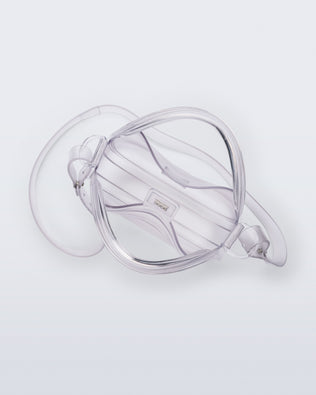Top view of a clear Mirror bag with cross body straps two clear handles.