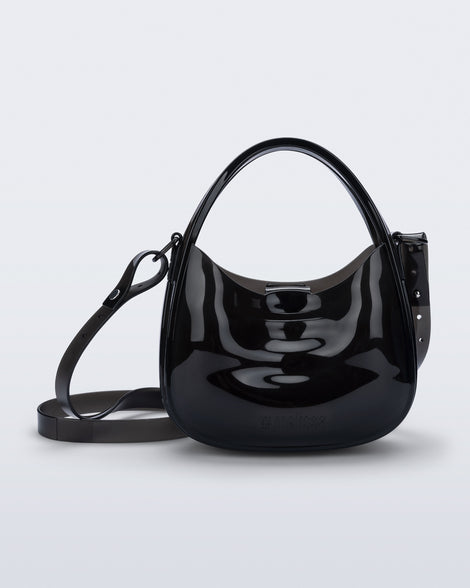 Front view of a clear black Mirror bag with cross body straps two clear handles.