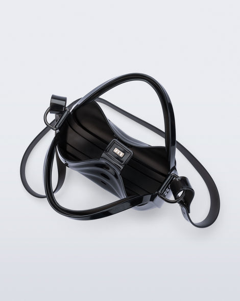 Top view of a clear black Mirror bag with cross body straps two clear handles.