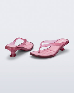 Back and angled view of a pair of pink Flip Flop Kitten Heels with clear pink straps