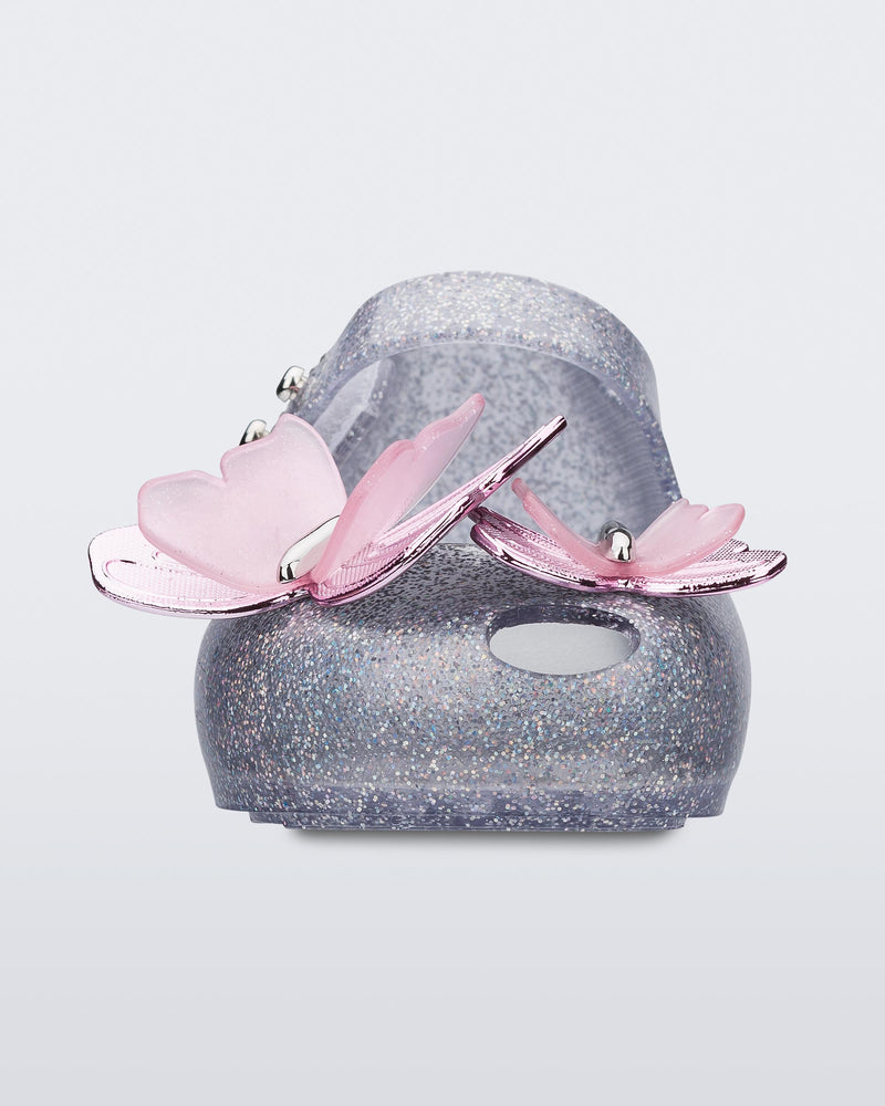 Front view of a silver glitter Ultragirl Butterfly baby ballerina flat with pink butterflies