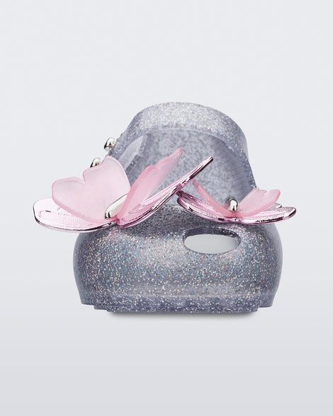 Front view of a silver glitter Ultragirl Butterfly baby ballerina flat with pink butterflies