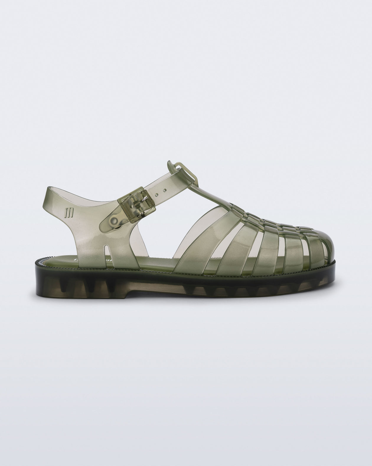 Side view of a transparent green Possession kids sandal