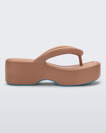Side view of a Melissa Free platform flip flop in brown with blue sole