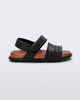 Side view of a black with brown insole Kaiteki baby sandal