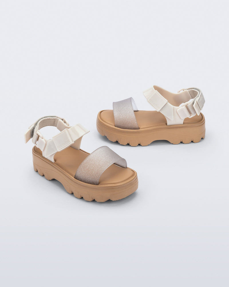 Angled and side view of a beige/glitter kids Kick Off Sandals