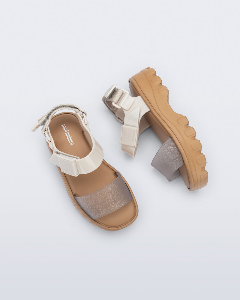 Top and side view of a beige/glitter kids Kick Off Sandals