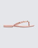 Side view of a pink Melissa Harmonic Studs flip flop with gold studs on the upper.