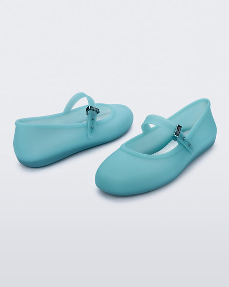 Back and side view of a pair of milky blue Soft Ballerina flats