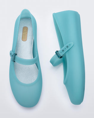 Top and side view of a pair of milky blue Soft Ballerina flats