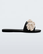 Side view of a black Babe Springtime women's slide with 3 beige flowers.