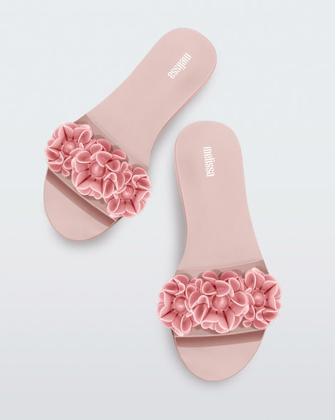 Top view of a pair of pink Babe Springtime women's slide with 3 pink flowers.