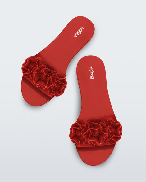 Top view of a pair of red Babe Springtime women's slide with 3 red flowers.