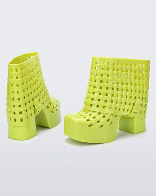 Back and angled view of a pair of green Marshall Columbia Clog platform Boots.