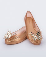 angled view of a pair of gold Sweet Love Butterfly kids flats.