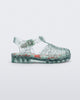 Side view of a clear star glitter green Possession baby fisherman sandal