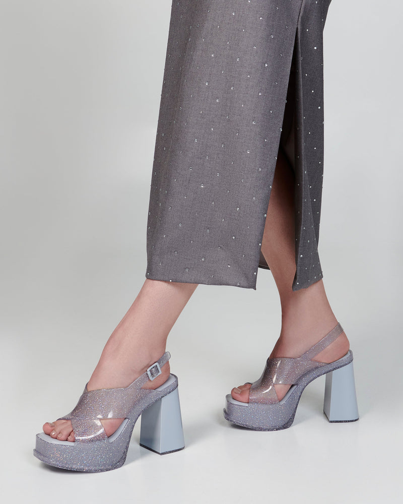 Model's legs wearing a pair of clear glitter Dance Heel platforms