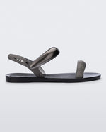 Side view of a black Eclipse Sandal with silver straps.