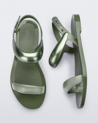 Top and side view of a pair of green Eclipse Sandals with glitter green straps.