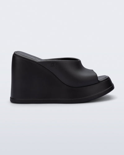Side view of a black Free Slip platform wedge heel