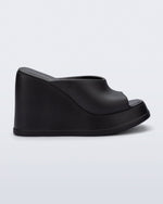 Side view of a black Free Slip platform wedge heel