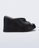 Side view of a black Free Slip platform wedge heel