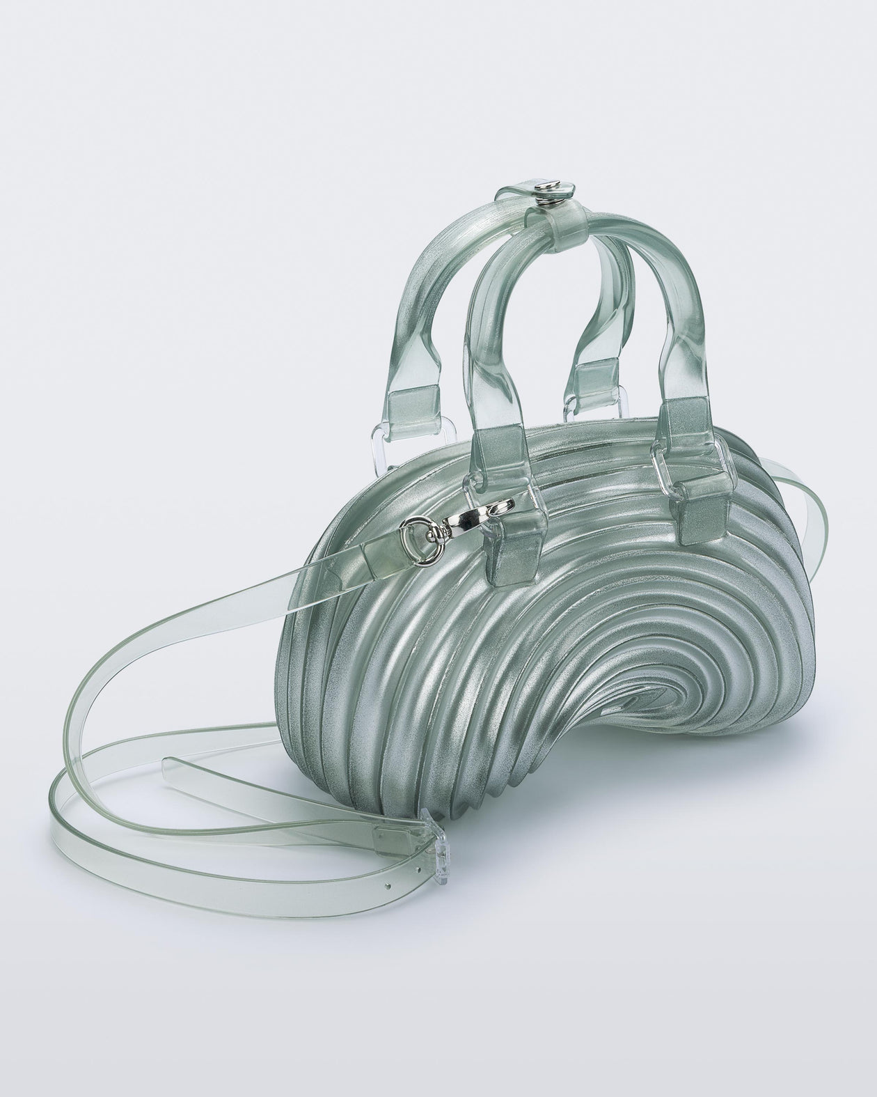 Angled view of a transparent blue Quantum Dome + Diesel bag with hand strap and shoulder strap