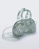 Angled view of a transparent blue Quantum Dome + Diesel bag with hand strap and shoulder strap