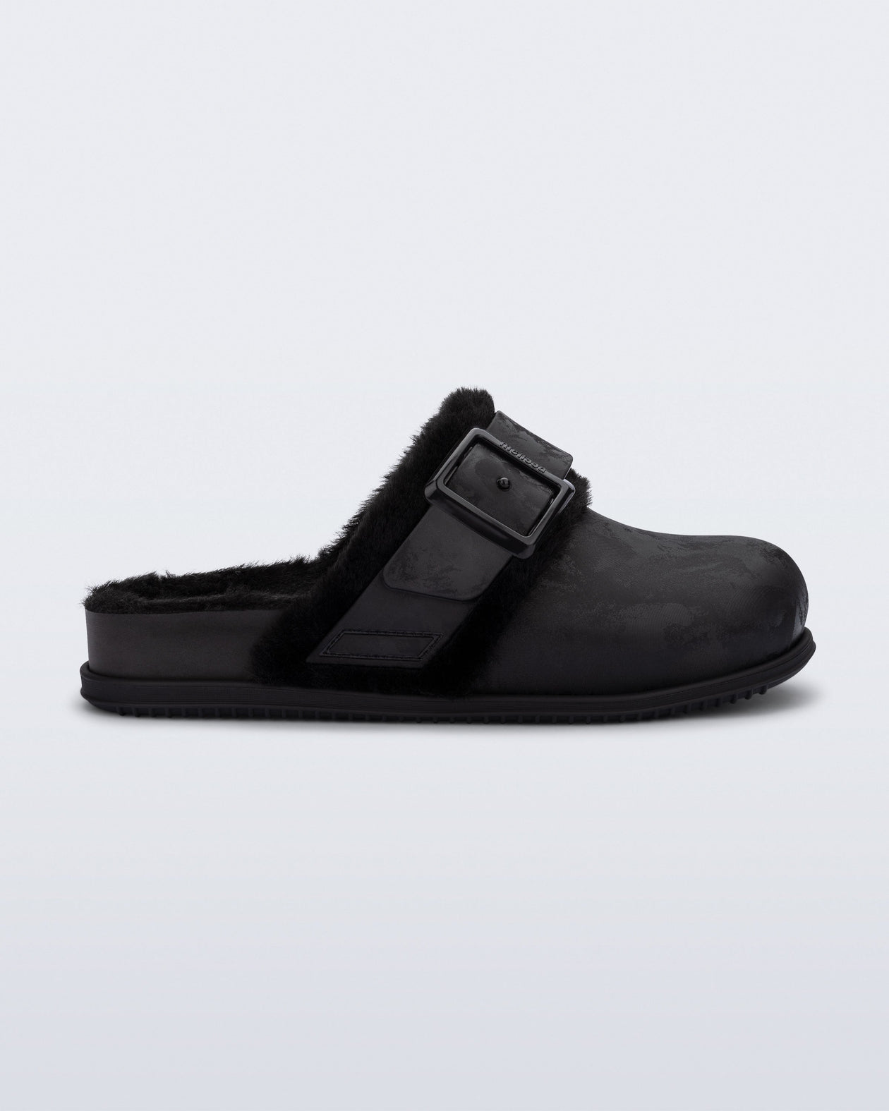 Side view of a black Cozy Warm clog with fuzzy insole