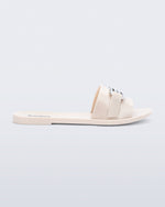 Side view of a beige Babe M Chic slide sandal