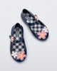 Top view of a pair of metallic blue Sweet Love Picnic baby flats with flowers