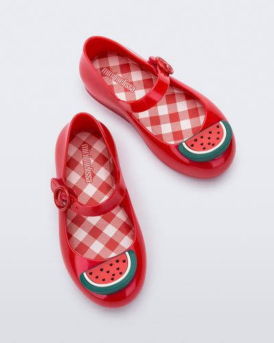 Top view of a pair of red Sweet Love Picnic baby flats with watermelon slices