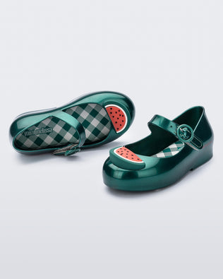 Angled and top view of a pair of green Sweet Love Picnic baby flats with watermelon slices
