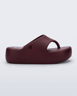 Side view of a burgundy Free Platform Thong sandal